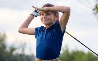 Girl playing golf